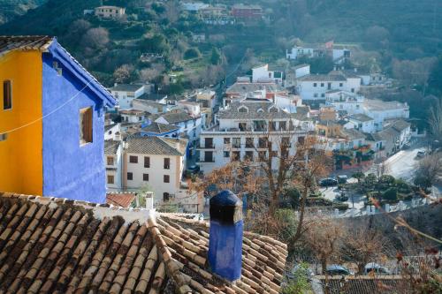 a view of a town from the roof of a house at Casa rural Los Abuelos in Monachil