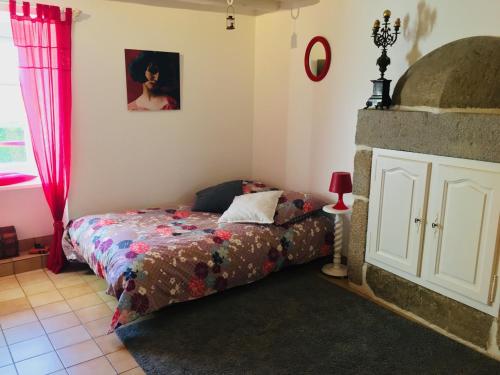 a bedroom with a bed and a window at Maison d'hôtes l'Angevinière, chambre des Anges proche Mont-Saint-Michel in Saint-Laurent-de-Terregatte