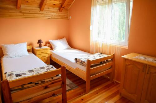 Postel nebo postele na pokoji v ubytování Adamov Konak Apartmani