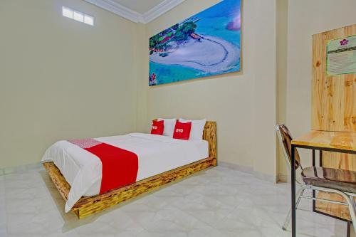 Lova arba lovos apgyvendinimo įstaigoje Super OYO 3774 Orchid 37 Syariah Guest House