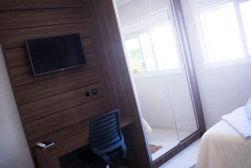 TV a/nebo společenská místnost v ubytování Sokulski Flat Hotel e Restaurante