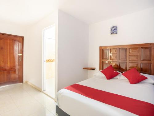 Postel nebo postele na pokoji v ubytování Hotel Casa Poblana