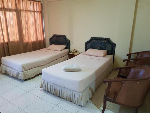 Posteľ alebo postele v izbe v ubytovaní OYO 2941 Hotel Istana