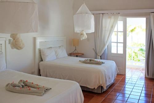 Postel nebo postele na pokoji v ubytování Hotel TODOBLANCO, Las Galeras, SAMANA