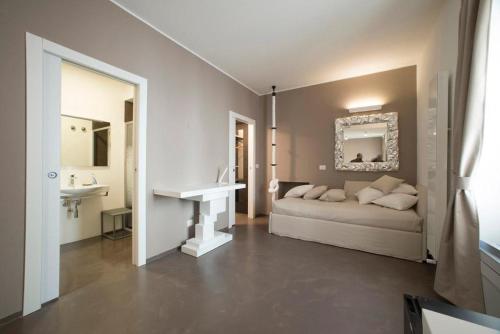 a bedroom with a bed and a sink in a room at L'Ottava GuestHouse in Milan