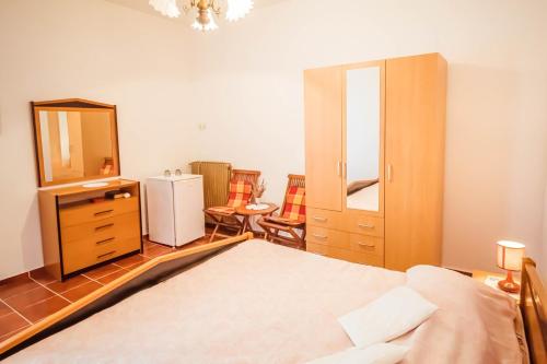 Ένα ή περισσότερα κρεβάτια σε δωμάτιο στο Room Luciana