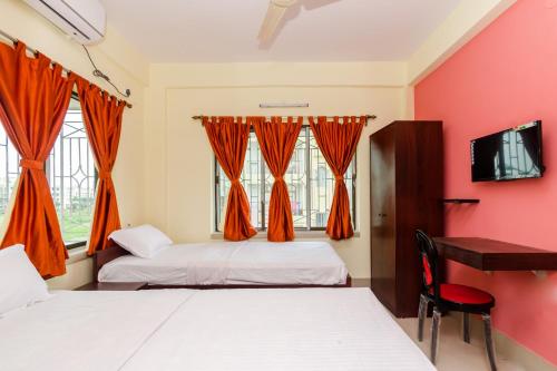 Ένα ή περισσότερα κρεβάτια σε δωμάτιο στο swaran stay guest house *****