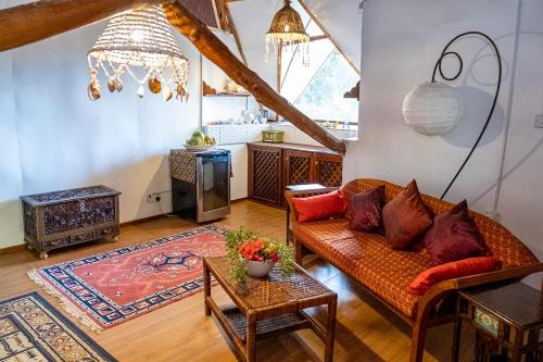a living room with a couch and a table at Utupoa in Matemwe