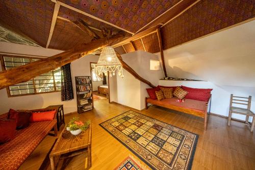 a living room with a couch and a table at Utupoa in Matemwe