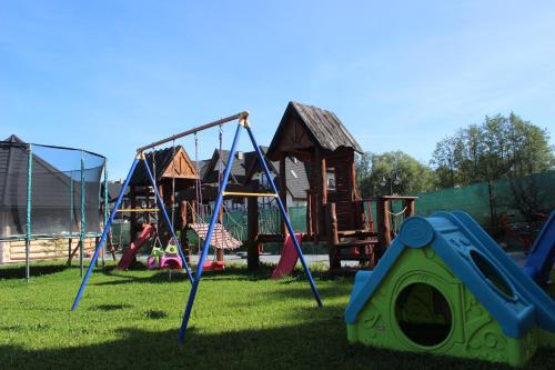 a playground with many different types of play equipment at Willa Stożek, 50 m od term i wyciągów narciarskich in Białka Tatrzanska