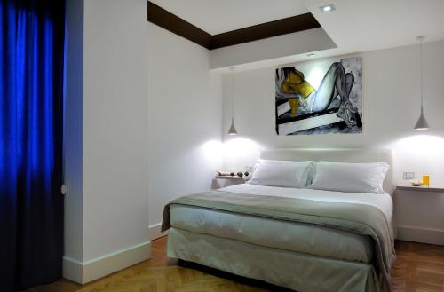 Postel nebo postele na pokoji v ubytování Hotel Principe Di Villafranca