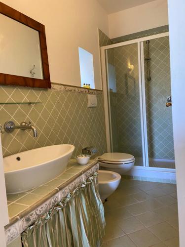 a bathroom with a sink and a toilet at La Casa Rossa in Maiori