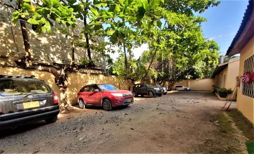a group of parked cars parked in a driveway at Condominio El Portal Casa 3 in Carmen de Apicalá
