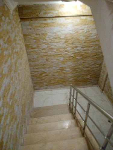 a staircase in a room with a brick wall at Asmir Suites Hotel in Nevsehir