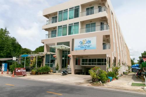 a building on the side of a street at Golden Beach Boutique Resort in Prachuap Khiri Khan
