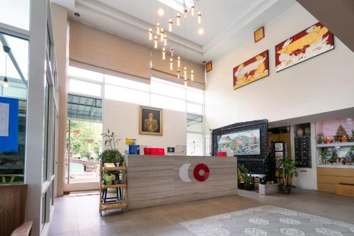 a lobby of a store with a reception desk at Golden Beach Boutique Resort in Prachuap Khiri Khan
