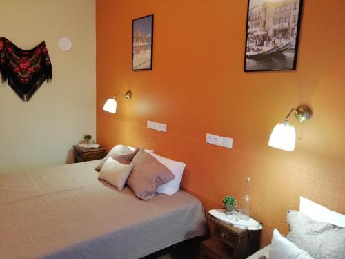 Ένα ή περισσότερα κρεβάτια σε δωμάτιο στο Plena Vita RESIDENCE