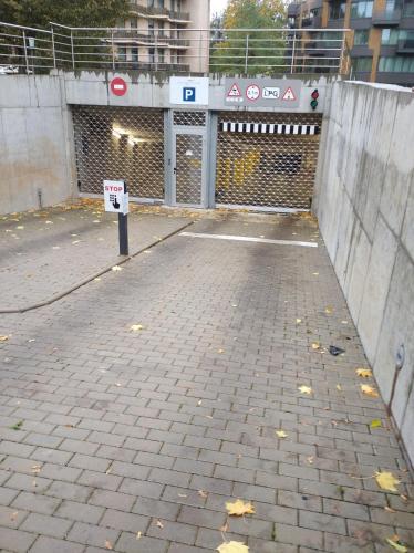 a parking lot with a no parking sign on it at Mint Studio in Druskininkai