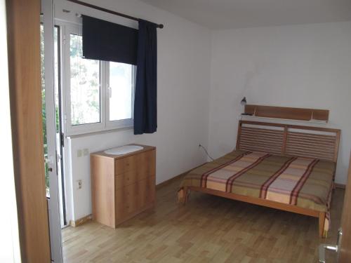 Un pat sau paturi într-o cameră la Apartments Žuvela