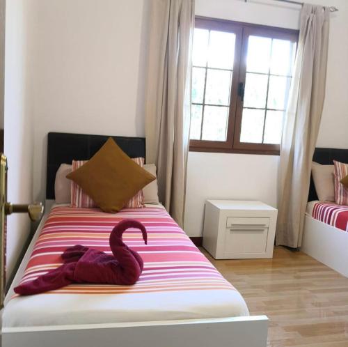 Llit o llits en una habitació de Villa Altamosa