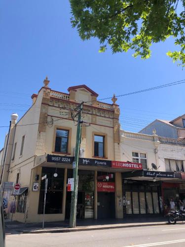 a building on the corner of a street at EBS Sydney Hostel in Sydney