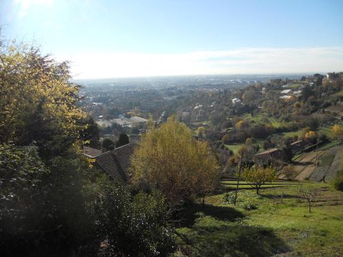 a view of a city from a hill with trees at Bed & Breakfast Sant'Erasmo in Bergamo