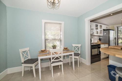 a kitchen with a dining room table and chairs at St Petersburg Vacation Rentals in St Petersburg