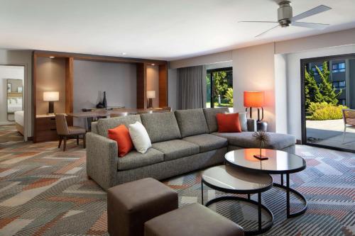 a living room with a couch and a table at Hyatt Regency Monterey Hotel and Spa in Monterey