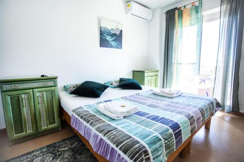 Llit o llits en una habitació de Corals B&B Apartment