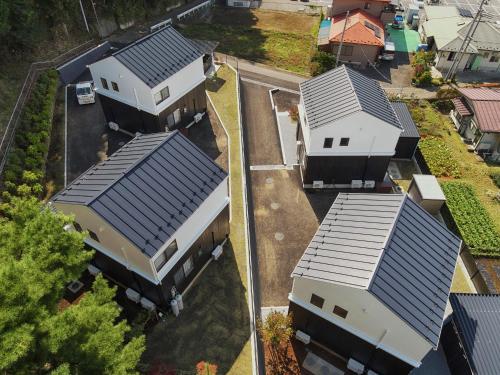 an overhead view of a row of houses with roofs at Villas Asama no Iori in Fujiyoshida