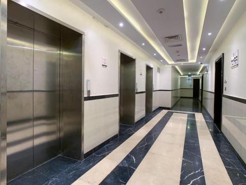 a hallway with elevators in a building at OYO 557 Home Starz Danube T2 -105 in Dubai