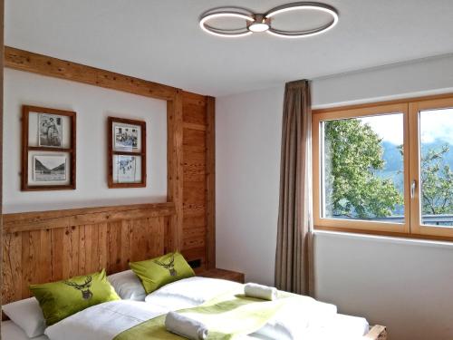 a bedroom with two beds and a window at Nature luxury Chalet INSToul in Lutago