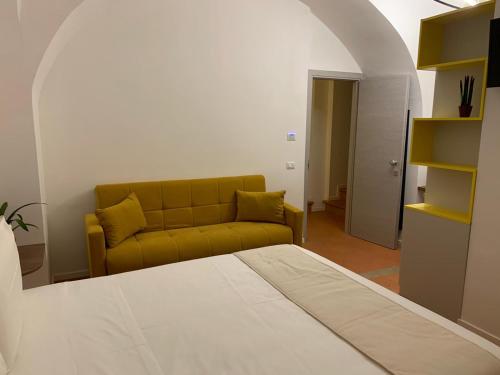 a living room with a couch and a bed at Relais Villa Montedonzelli in Naples