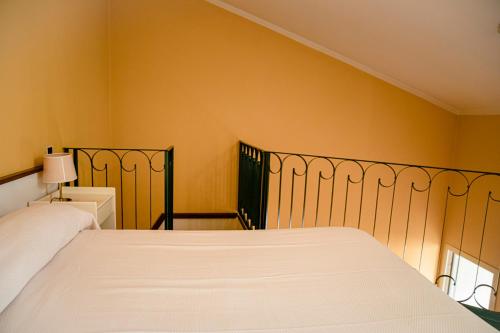 Ένα ή περισσότερα κρεβάτια σε δωμάτιο στο Hotel San Genesio