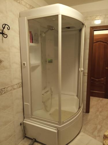 a shower stall with a toilet in a bathroom at Bed & breakfast Mezzaluna in Feletto