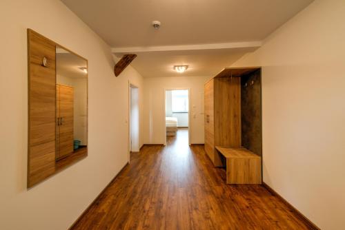 a hallway of a house with wooden floors at Heidequartier Harz in Wernigerode