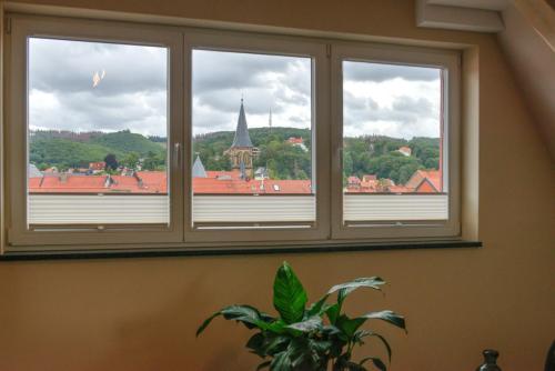 a window with a view of a city at Heidequartier Harz in Wernigerode