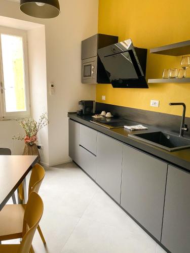 a kitchen with a sink and a counter top at La Ripa Camere Vernazza in Vernazza