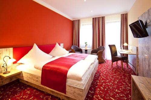 Postel nebo postele na pokoji v ubytování Hotel Römerstadt