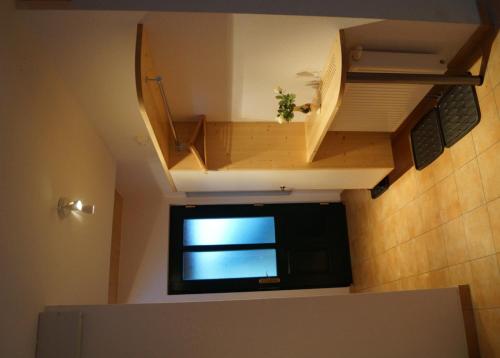 a small window in a small room with a staircase at Chalet Olympia in Neustift im Stubaital