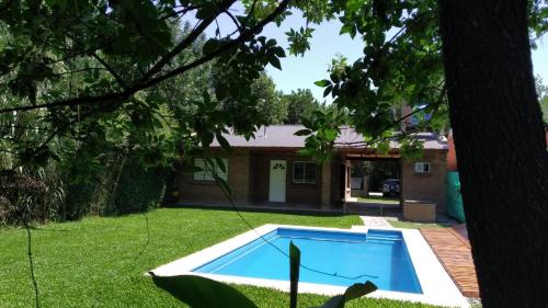 a swimming pool in the yard of a house at CASA FUNES in Funes