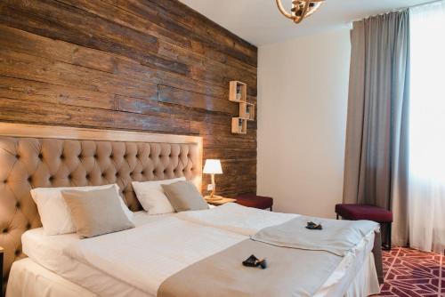 
Łóżko lub łóżka w pokoju w obiekcie Hotel Podklasztorze
