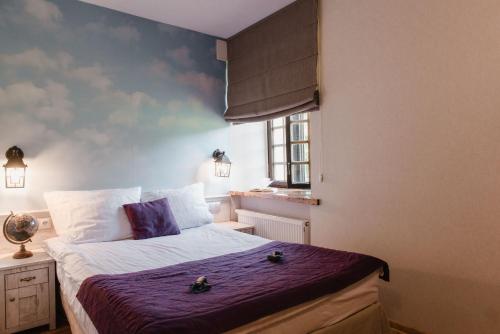 Postel nebo postele na pokoji v ubytování Hotel Podklasztorze