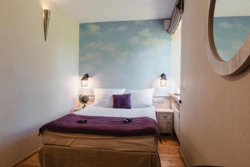 Postel nebo postele na pokoji v ubytování Hotel Podklasztorze