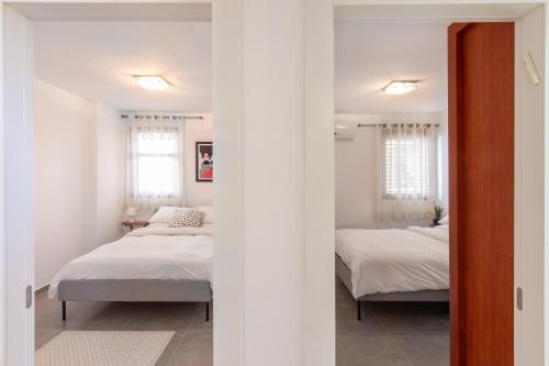 Postel nebo postele na pokoji v ubytování La Maison de Raphael