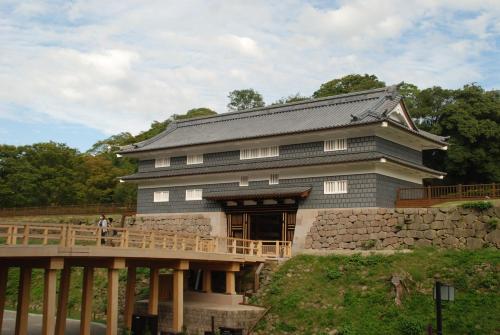 a building with a bridge in front of it at Town Hotel 41 in Kanazawa