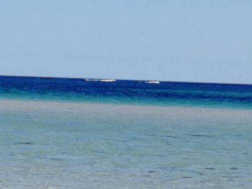 a large body of water with the ocean at The Fisherman's Snug self catering North Uist in Paible