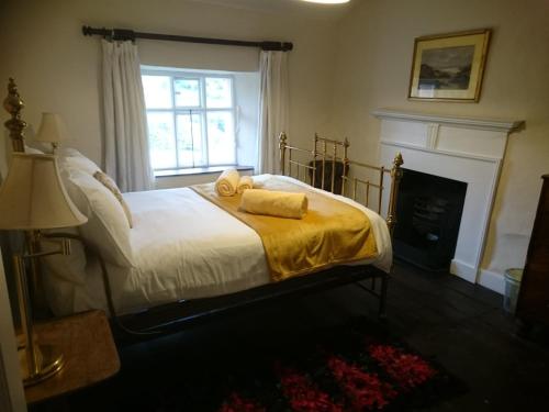 a bedroom with a bed with two towels on it at Low House Farm North, Troutbeck, Windermere in Windermere