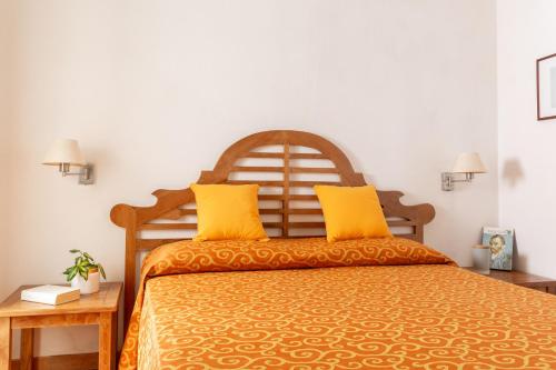 מיטה או מיטות בחדר ב-Sweet Home Isolotto - direttamente sulla spiaggia