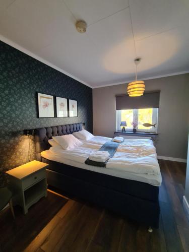 
Säng eller sängar i ett rum på Dala-Järna Hotell och Vandrarhem
